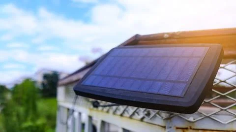 Close up small solar panel designed to power decorative lights along a balc.. Stock Photos