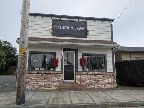 Close-up of small storefront labeled Timber and Tone Stock Photos