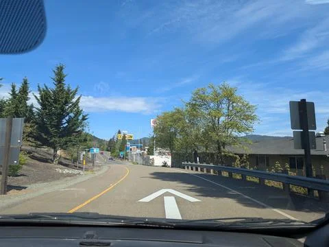 Close-up of small-town freeway exit with Chevron and 76 gas station Stock Photos