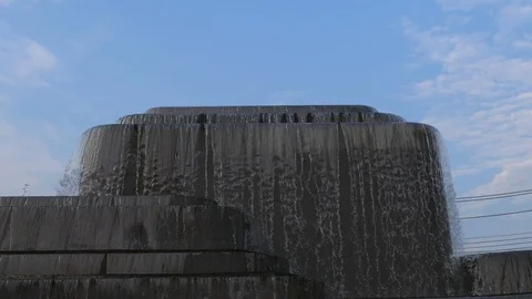 Close up of small waterfall with blue sky background Stock Footage 114976378
