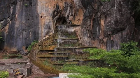 Close up of a small waterfall in a deep forest 動画素材 83214976