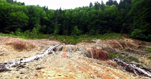 Close-up of A Small Waterfall In The Mountains with Green Trees,Slow Motion Stock Footage 64589195