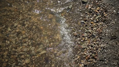 Close Up Small Waves Splashing On Shore Stock Footage 103074479