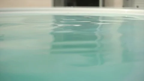 Close up of small waves of water on hot tub in 4k Stock Footage 94221853