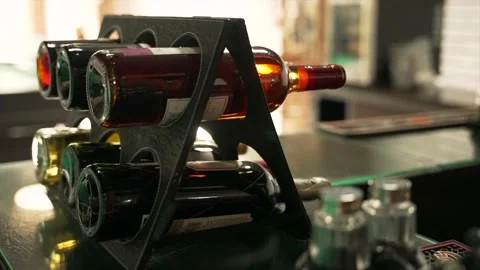 Close-up of small wine rack with bottles on table of hotels restaurant Видео 208427038