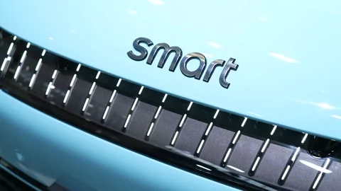 Close up of Smart car logo and front grille displayed at automotive exhibition Stock Footage 334998933