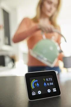 Close Up Of Smart Energy Meter In Kitchen Measuring Electricity And Gas Use W Stock Photos