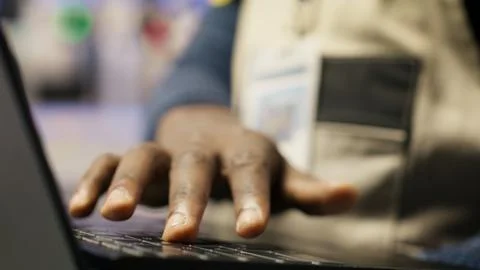 Close up of smart factory worker using laptop to test automated systems Stock Photos