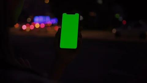 Close-up of smart girl interacting with vertical smartphone mock chrome key Stock Footage 117555184