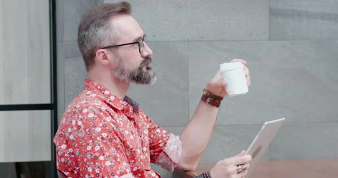 Close up smart handsome old man mustache relax with tablet in outdoor Stock Footage 150774560