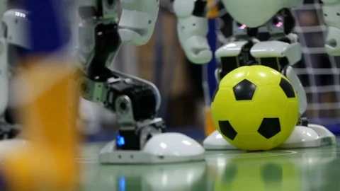 Close up of smart humanoid robot foot playing football. Stock Footage 106514119