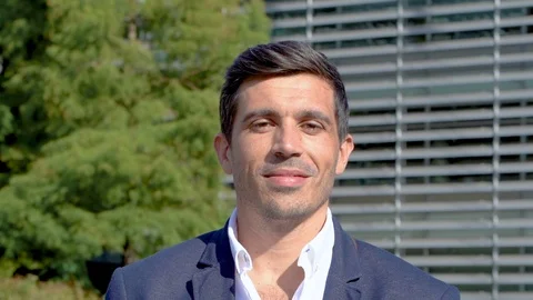 Close up of smart man smiling at camera, slow motion Stock Footage 96067038