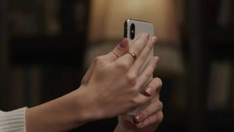 Close-up of a smart phone in woman's hands doing selfie Stock Footage 175176307