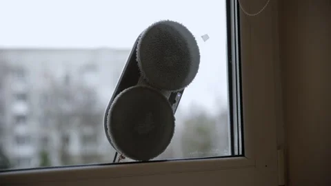 Close-up of a Smart Window Cleaning Robot on Glass Stock Footage 331876207