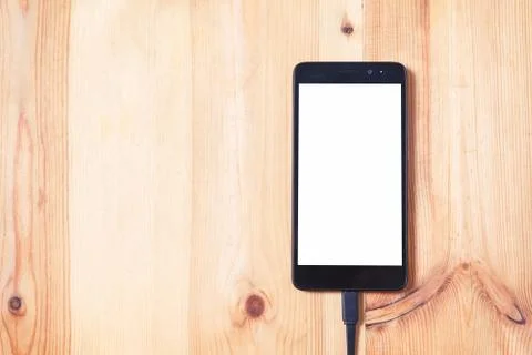 Close up smartphone and data connecting cable for transfer and Charge battery Stock Photos