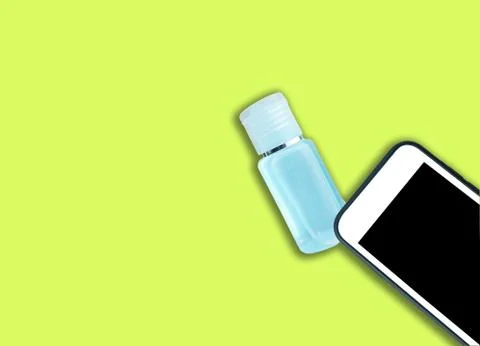 Close-up smartphone and small plastic bottle of sanitizer antibacterial gel,  Stock Photos