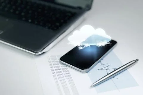 Close up of smartphone with cloud icon projection 写真素材