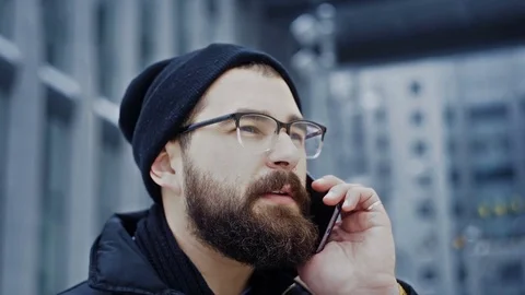 Close up smartphone concentrated man talking on phone Stock Footage 71981983