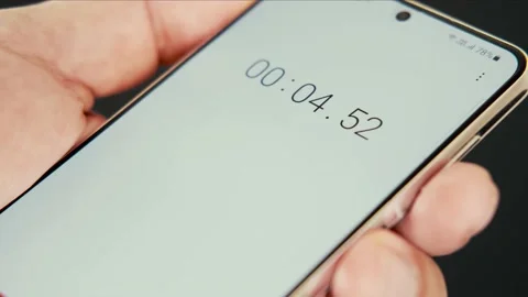 Close up of smartphone with digital stopwatch or timer on the screen. Stock Footage 156729110
