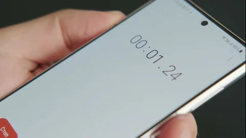Close up of smartphone with digital stopwatch or timer on the screen. Stock Footage 158525077