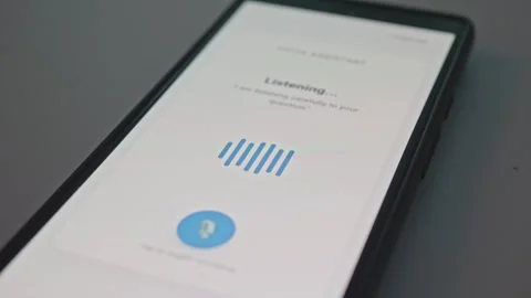 Close up of smartphone display showing voice assistant listening and processing 動画素材 341569749