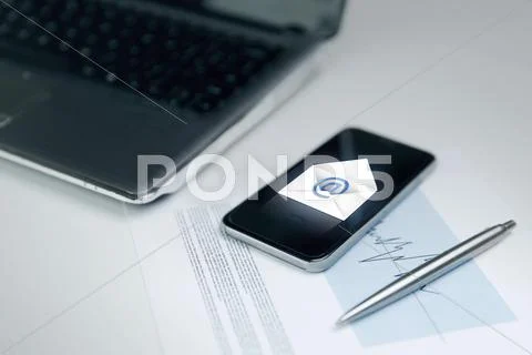 Close up of smartphone with email message icon Stock Photos
