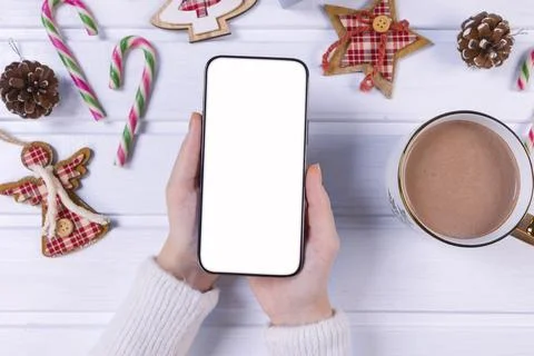 Close up smartphone with empty screen mockup on holiday background 库存照片