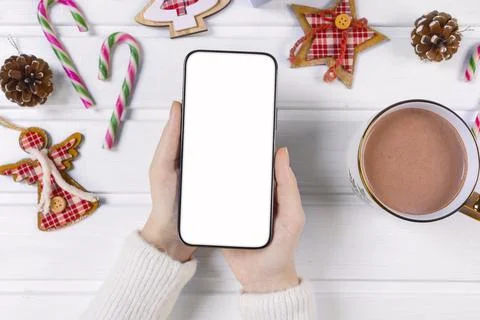 Close up smartphone with empty screen mockup on holiday background 库存照片