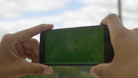 Close-up of smartphone with Green Screen at Eiffel Tower, holding by man in Stock Footage 111926507