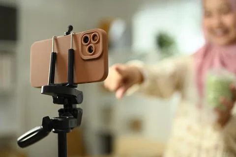 Close up of a smartphone mounted on a stand preparing for a video or livestream Stock Photos