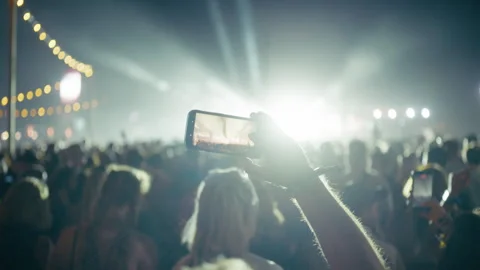 Close Up of Smartphone Recording Stage Performance at Festival Stock Footage 345893259