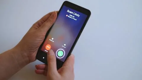 Close-up of smartphone screen displaying dangerous incoming scam call. Stock Photos