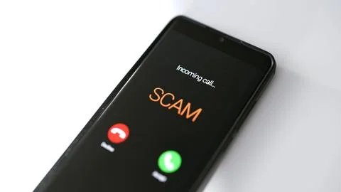 Close-up of smartphone screen displaying dangerous incoming scam call. Stock Photos