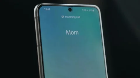 Close Up Smartphone Screen With Incoming Call Indication. Incoming Call From Mom 動画素材 156728922