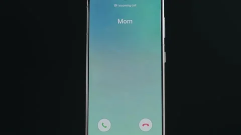 Close Up Smartphone Screen With Incoming Call Indication. Incoming Call From Mom Stock Footage 157722148