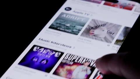 Close up of smartphone screen opening podcast app as finger taps the display Stock Footage 334161460