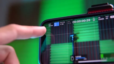 Close-up of smartphone screen. Operator's finger presses FPS and Shutter control Stock Footage 280339162