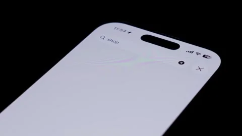 Close up of smartphone screen showing alshopping app download page in App Store Stock Footage 334161469
