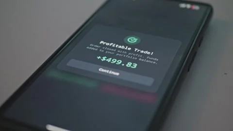 Close up of smartphone screen showing successful stock trade notification order Stock Footage 341569680
