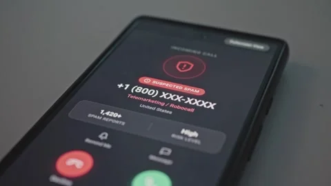 Close up of smartphone screen showing suspected spam call warning and caller Stock Footage 341569711