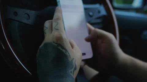 Close-up of smartphone use inside a vehicle, representing mobile... Stock Footage 341613023