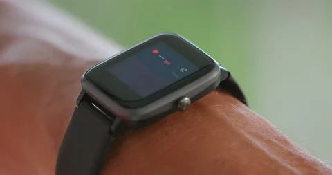 Close-up smartwatch on male hand checking the heart rate or pulse. Outside. Stock Footage 233224471
