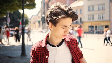 Close up smiling boy using mobile phone look around walk in city guy business Stock Footage 92051267