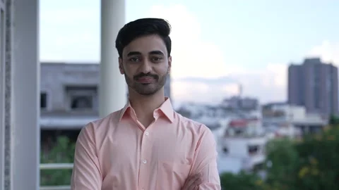 Close up Smiling confident young pretty Indian ethnic male looking at camera. Видео 170430006