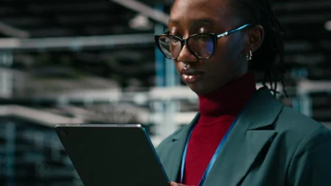 Close up of smiling data center female engineer futureproofing company network Stock Footage 329721171
