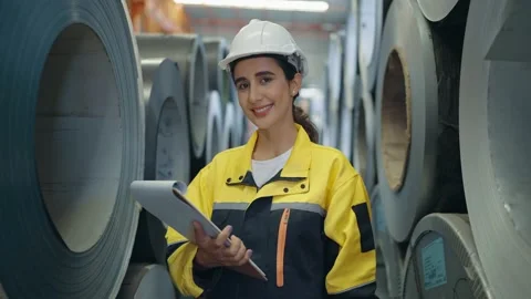 Close up smiling face of Hispanic Latin woman engineer looking camera in factory Stock-Footage 239049774