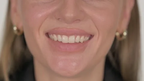 Close up of Smiling Female Lips on White Background Stock Footage 295902007
