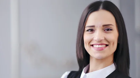Close-up smiling fresh face of beautiful Caucasian businesswoman posing and Видео 104225557