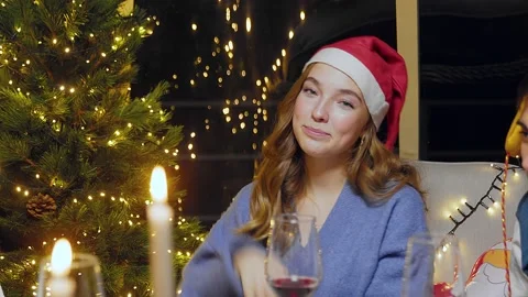 Close-up of a smiling girl looking at the camera for New Years. Friends Stock Footage 167244776
