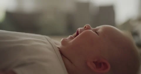Close-Up of Smiling Infant Boy on Changing Table Stock Footage 317782299